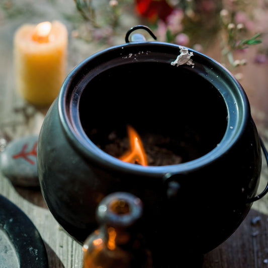 A cauldron with a flame inside