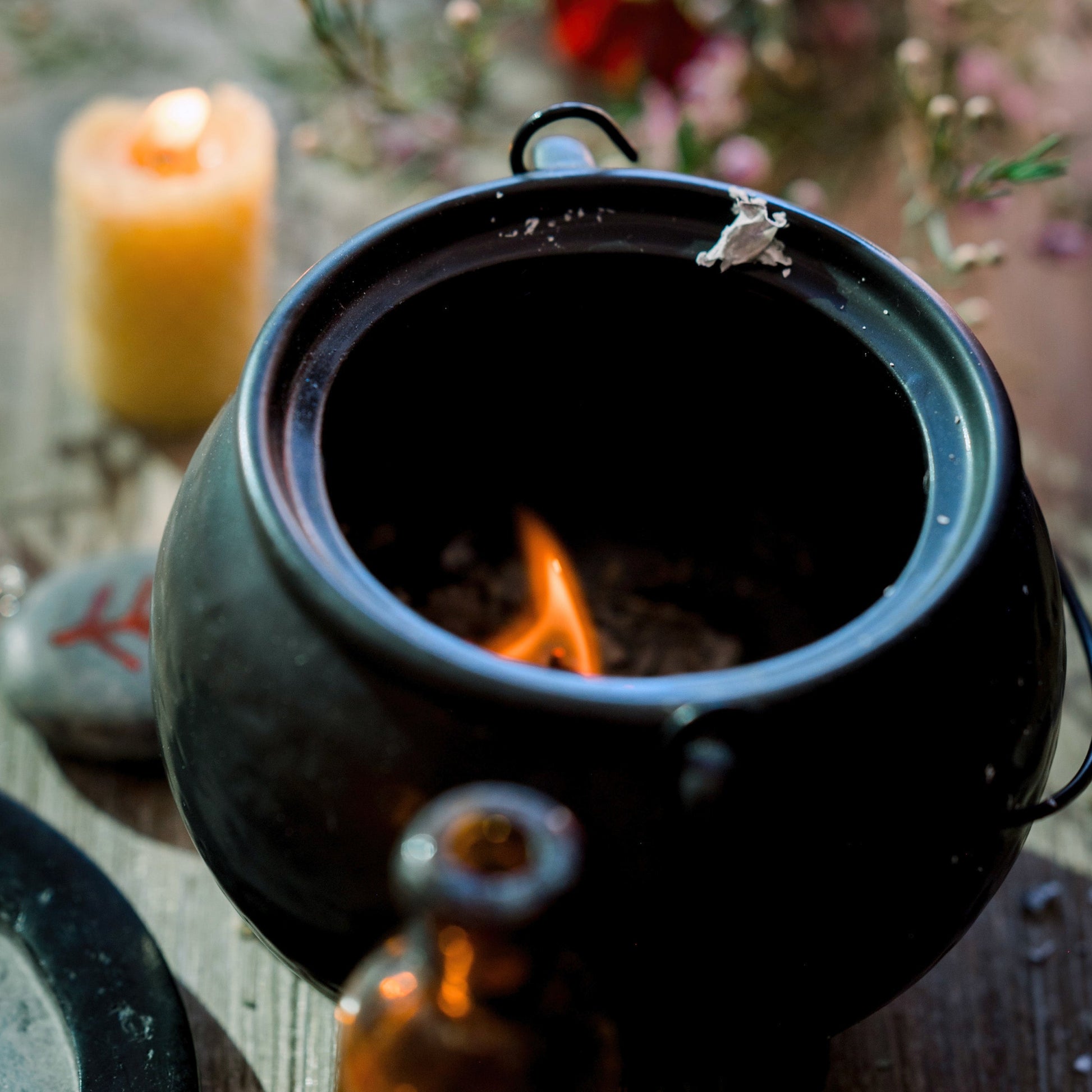 A cauldron with a flame inside